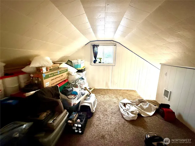 a bedroom with bed and a window