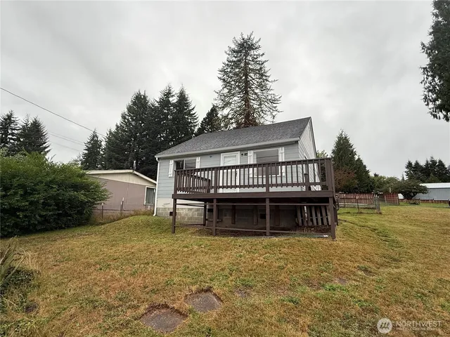a view of a house with backyard porch and sitting area