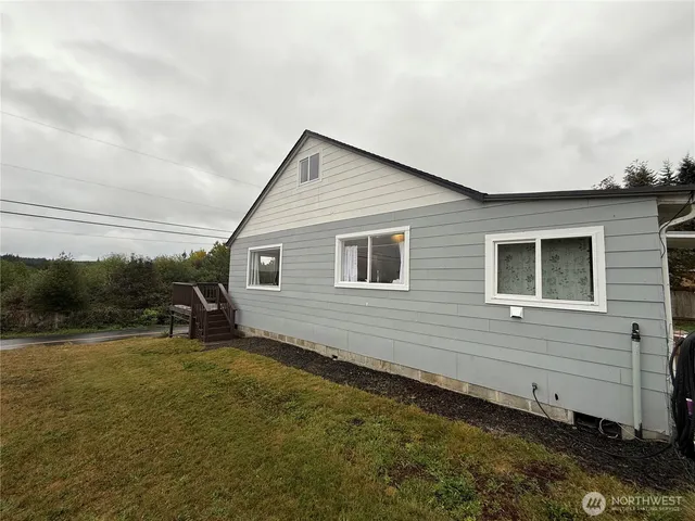 a view of a backyard of the house