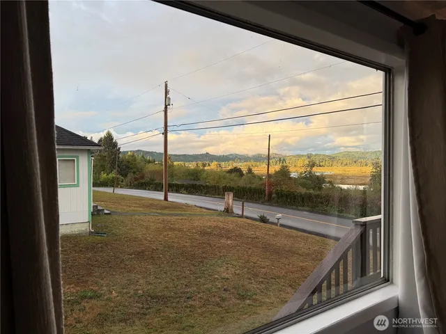 a view of a room with a big yard