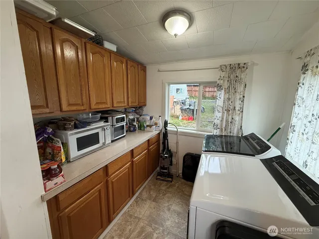 a kitchen that has a sink and a stove in it