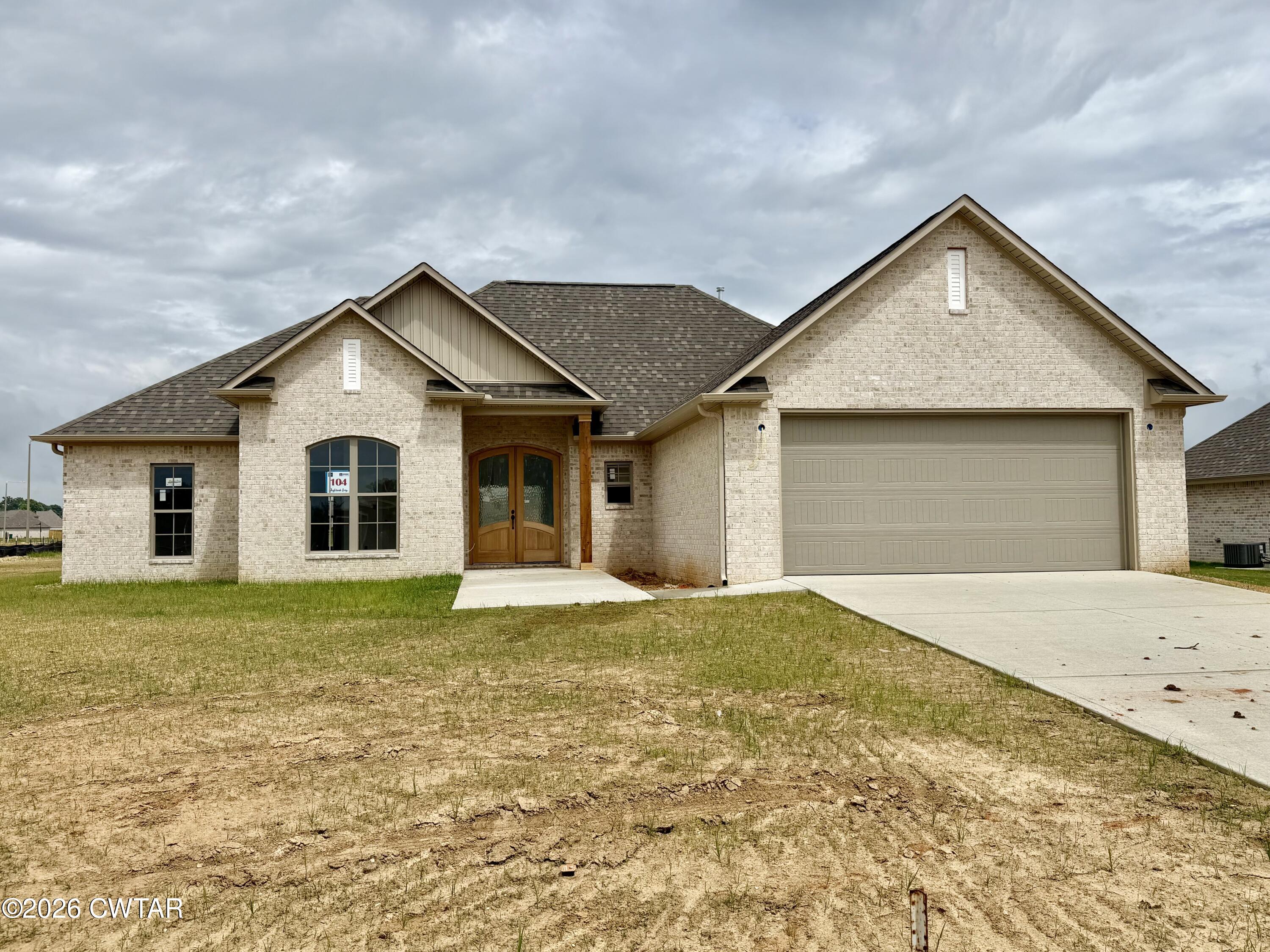 104 Daybreak Loop Medina, TN 38355 - Photo 1 of 3 a front view of the house with yard