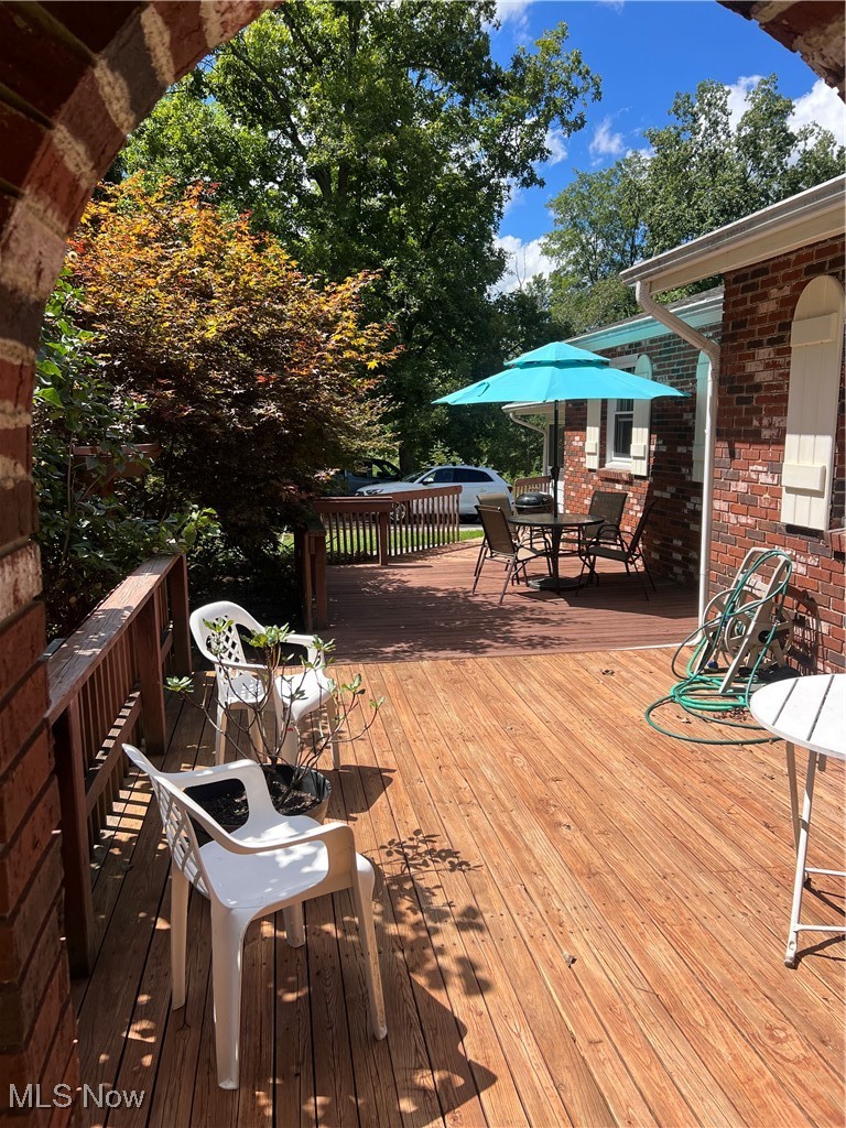 6171 Barrett Road Geneva, OH 44041 - Photo 12 of 38 Deck with outdoor dining area