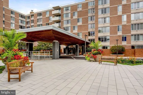 a view of a building with sitting area