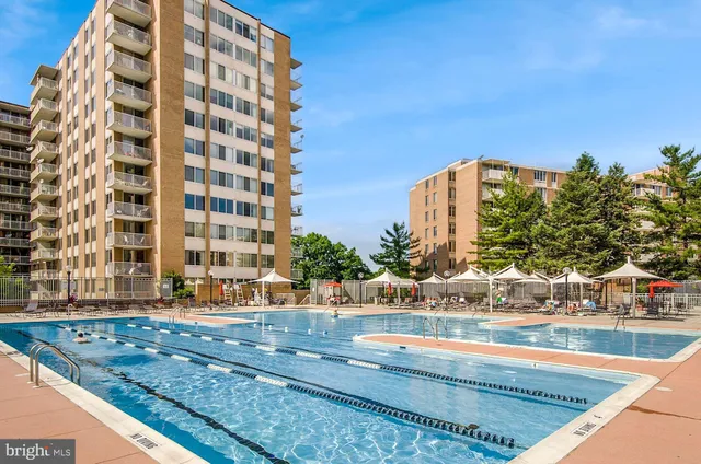 a view of building along with the road and shops