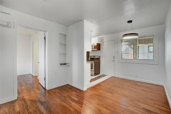 a view of livingroom with hardwood floor and hallway