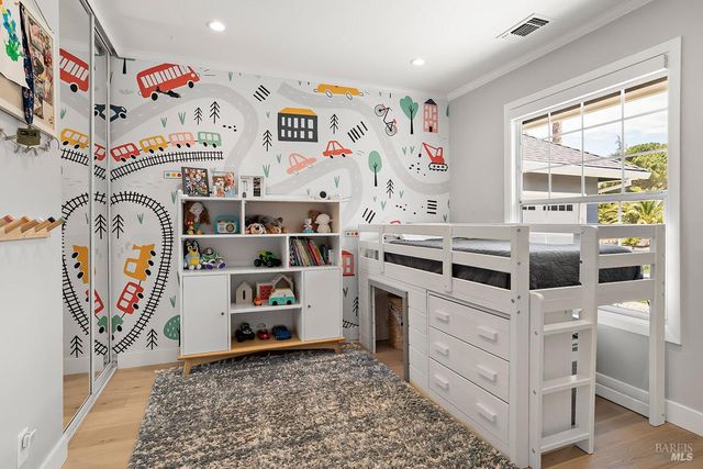 a kitchen with a refrigerator and a stove top oven