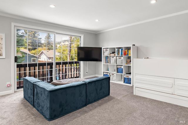 a reading room with furniture and window