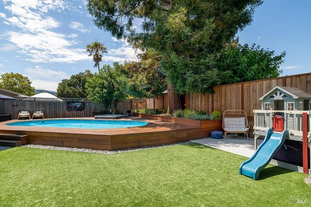 a childrens park with lots of swings and slides