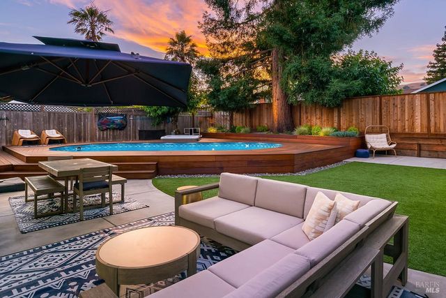 a view of yard with patio