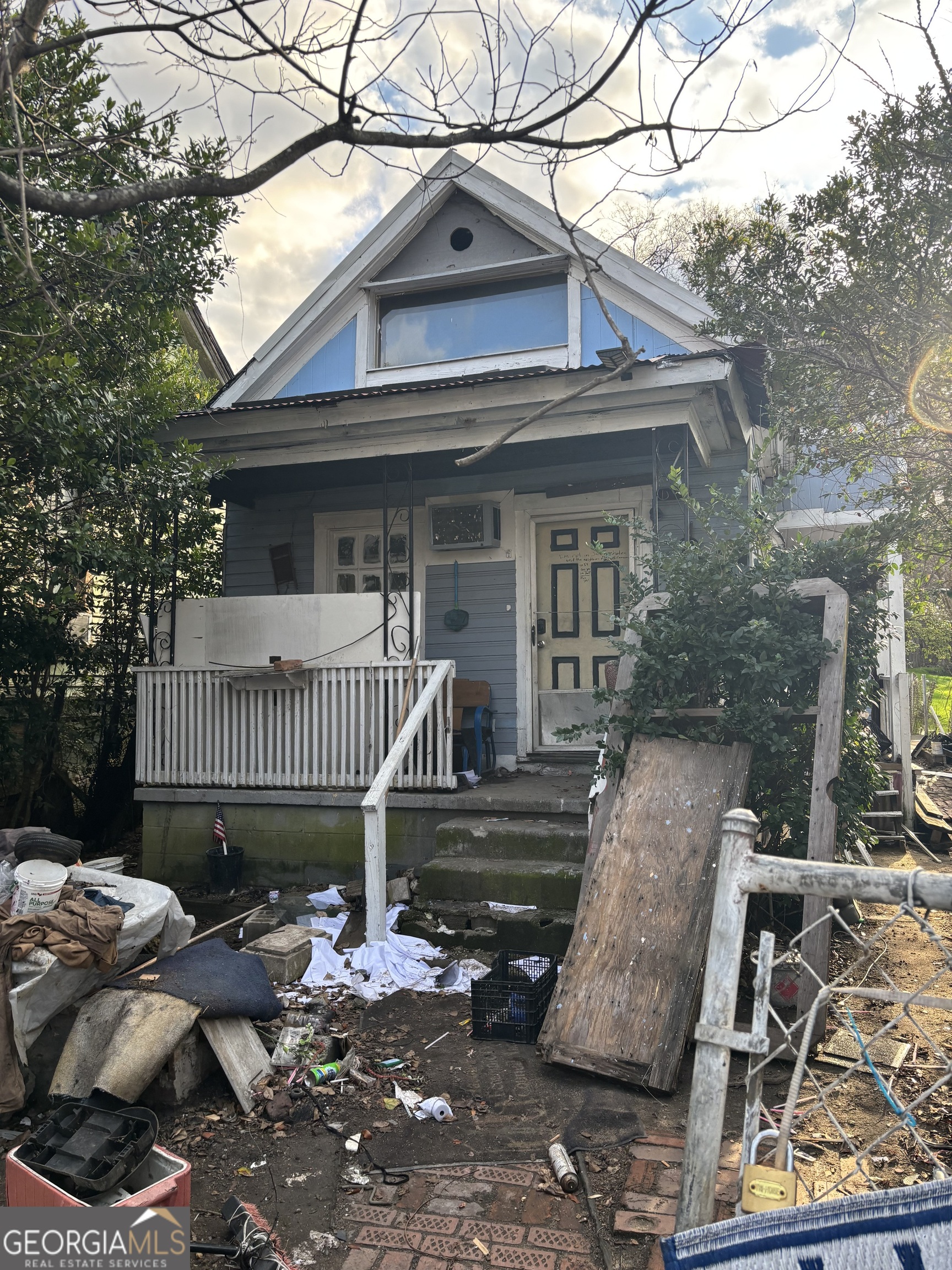 a view of a house with a roof deck and furniture