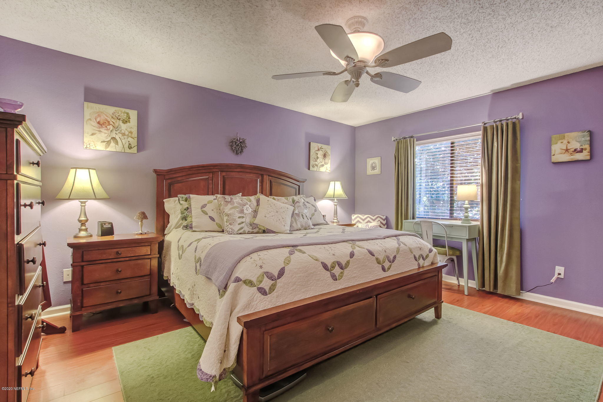 4816 Playschool Drive Jacksonville, FL 32210 - Photo 14 of 49 a bed sitting in a bedroom next to a window