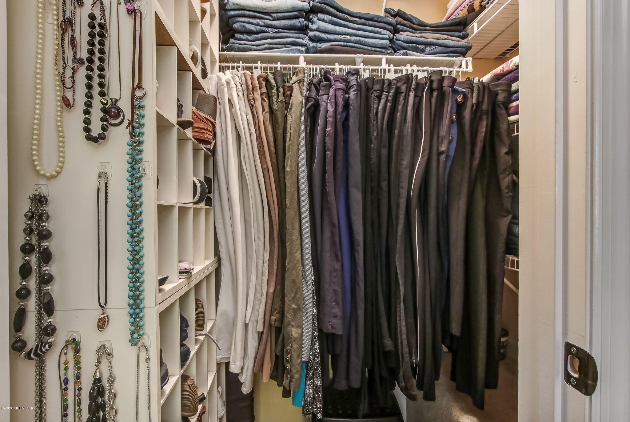 4816 Playschool Drive Jacksonville, FL 32210 - Photo 16 of 49 a view of walk in closet with clothes