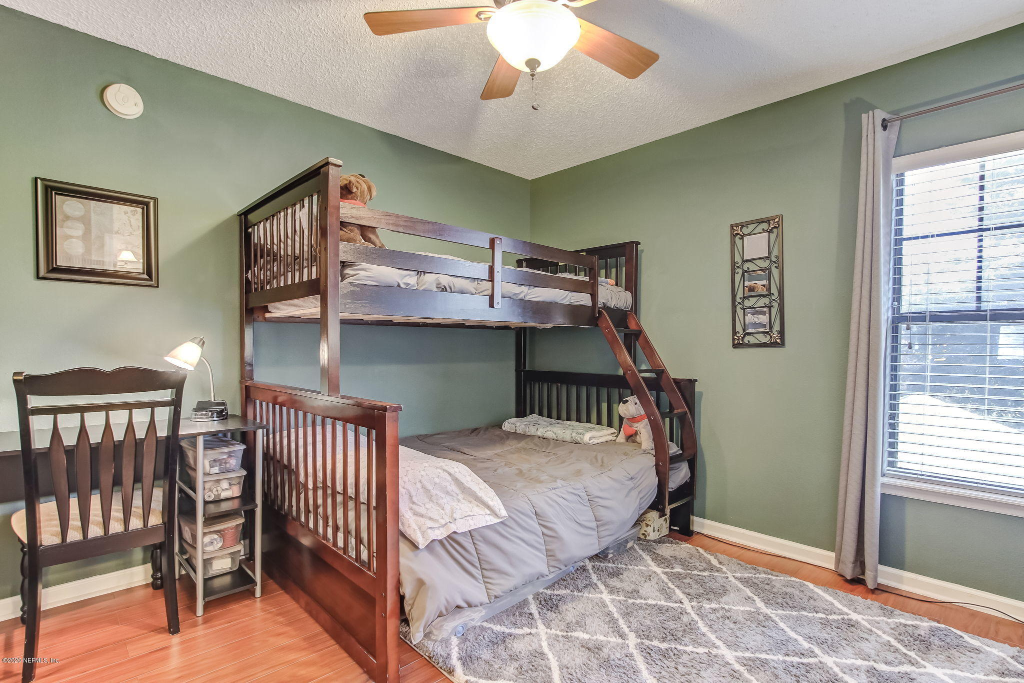 4816 Playschool Drive Jacksonville, FL 32210 - Photo 17 of 49 a bedroom with furniture and a window