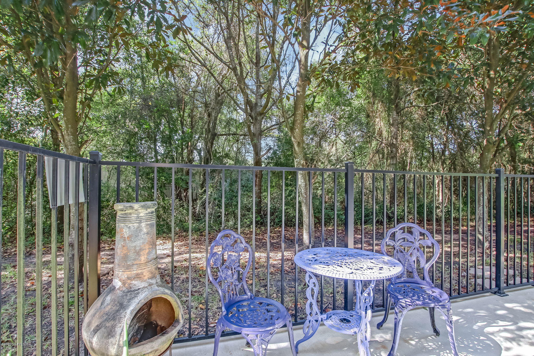 4816 Playschool Drive Jacksonville, FL 32210 - Photo 20 of 49 a view of a deck with a table and chairs with wooden fence