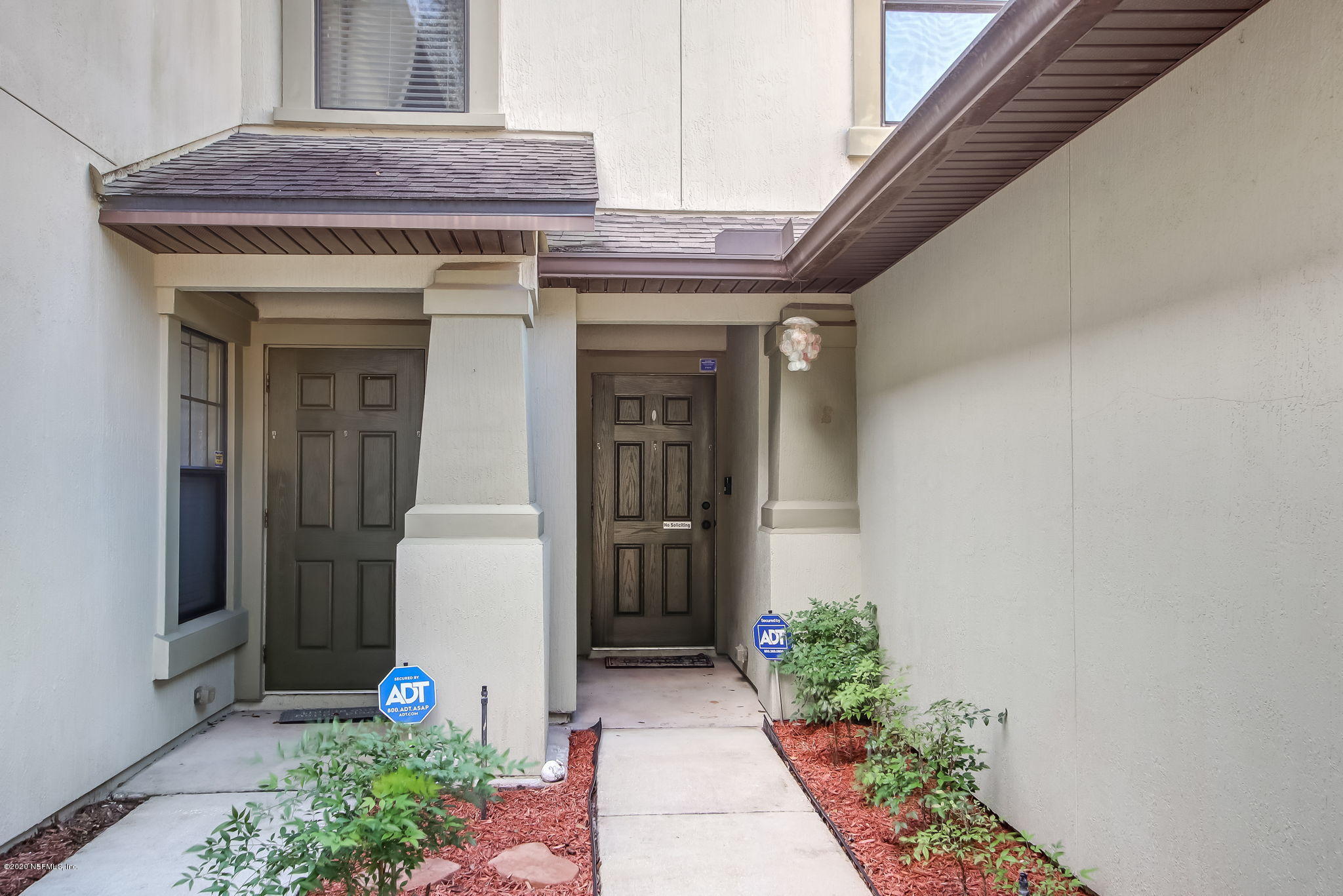 4816 Playschool Drive Jacksonville, FL 32210 - Photo 3 of 49 a view of a house with potted plants