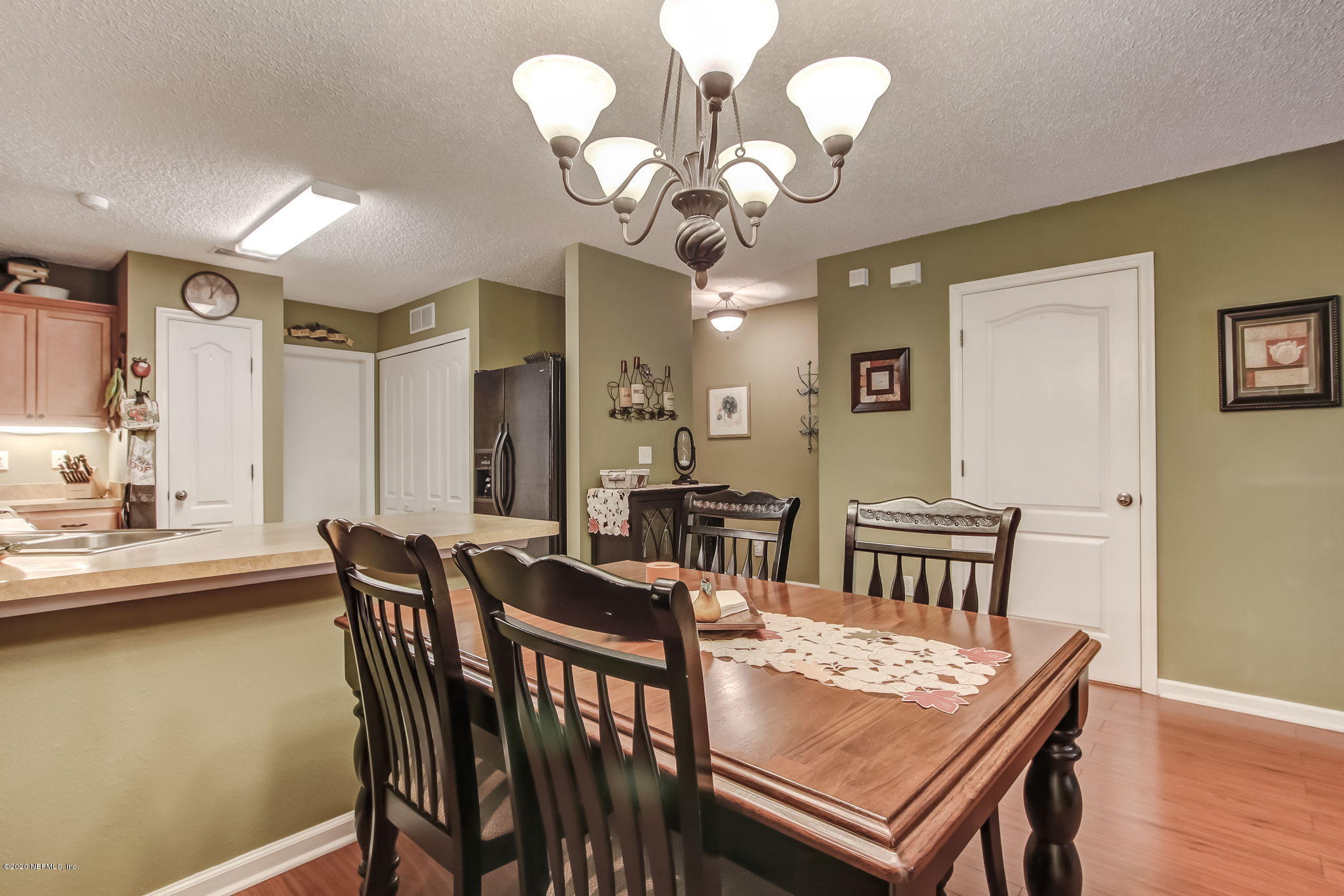 4816 Playschool Drive Jacksonville, FL 32210 - Photo 31 of 49 a view of a dining room with furniture and wooden floor