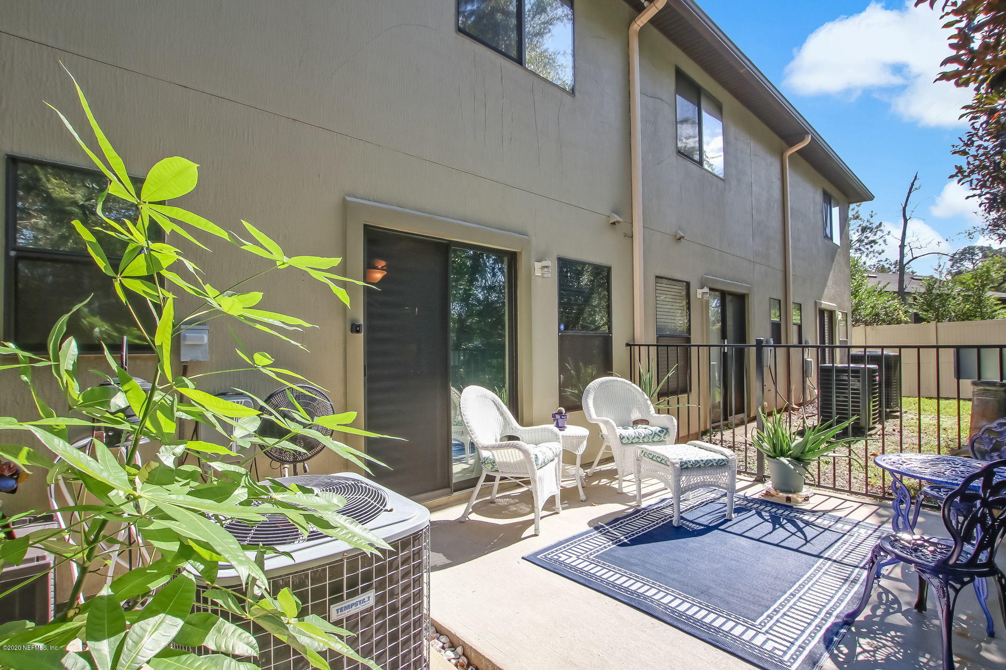 4816 Playschool Drive Jacksonville, FL 32210 - Photo 40 of 49 a view of a patio with table and chairs and potted plants