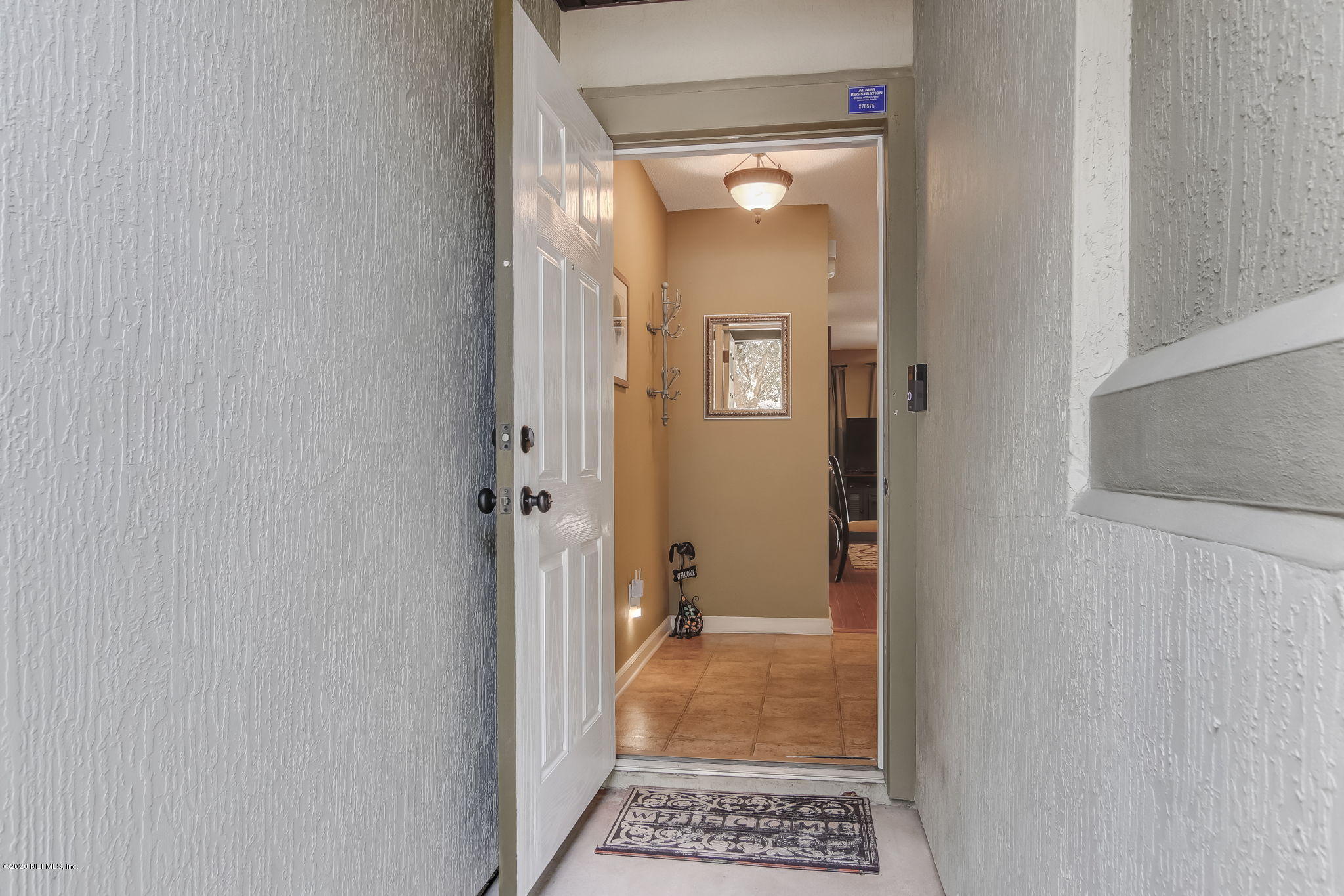 4816 Playschool Drive Jacksonville, FL 32210 - Photo 4 of 49 a view of a bathroom from a hallway
