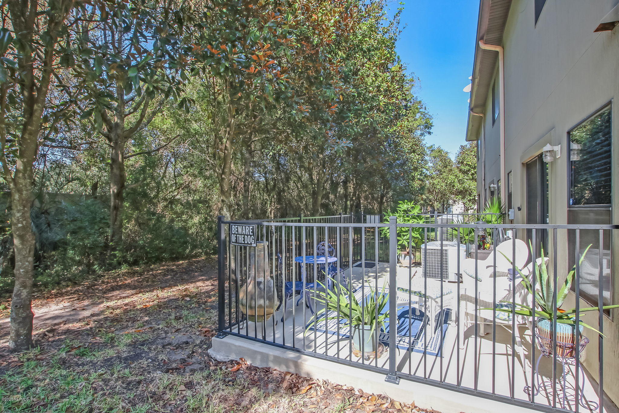 4816 Playschool Drive Jacksonville, FL 32210 - Photo 41 of 49 a view of a chair with a wooden fence