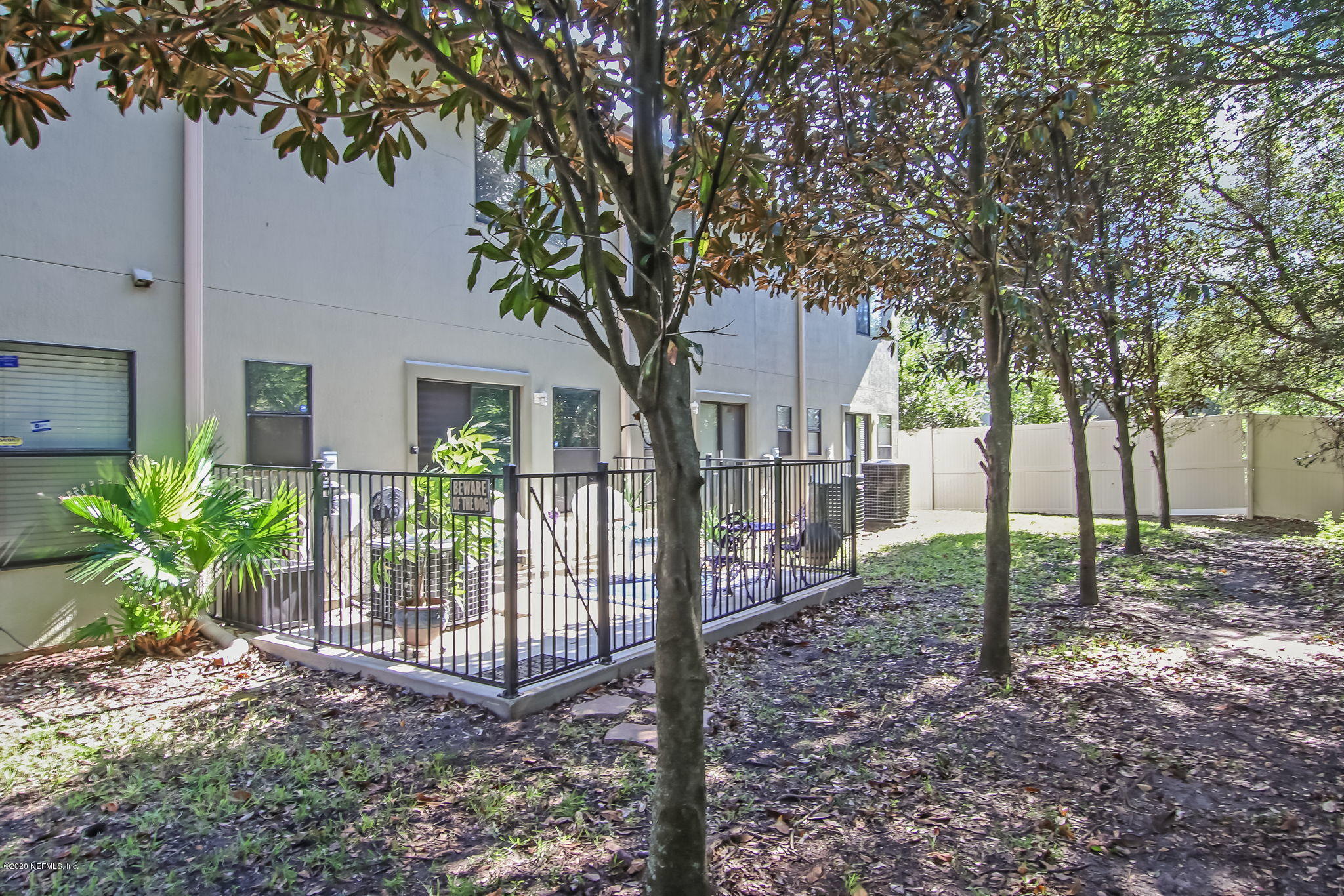 4816 Playschool Drive Jacksonville, FL 32210 - Photo 42 of 49 a view of a house with a tree in the yard