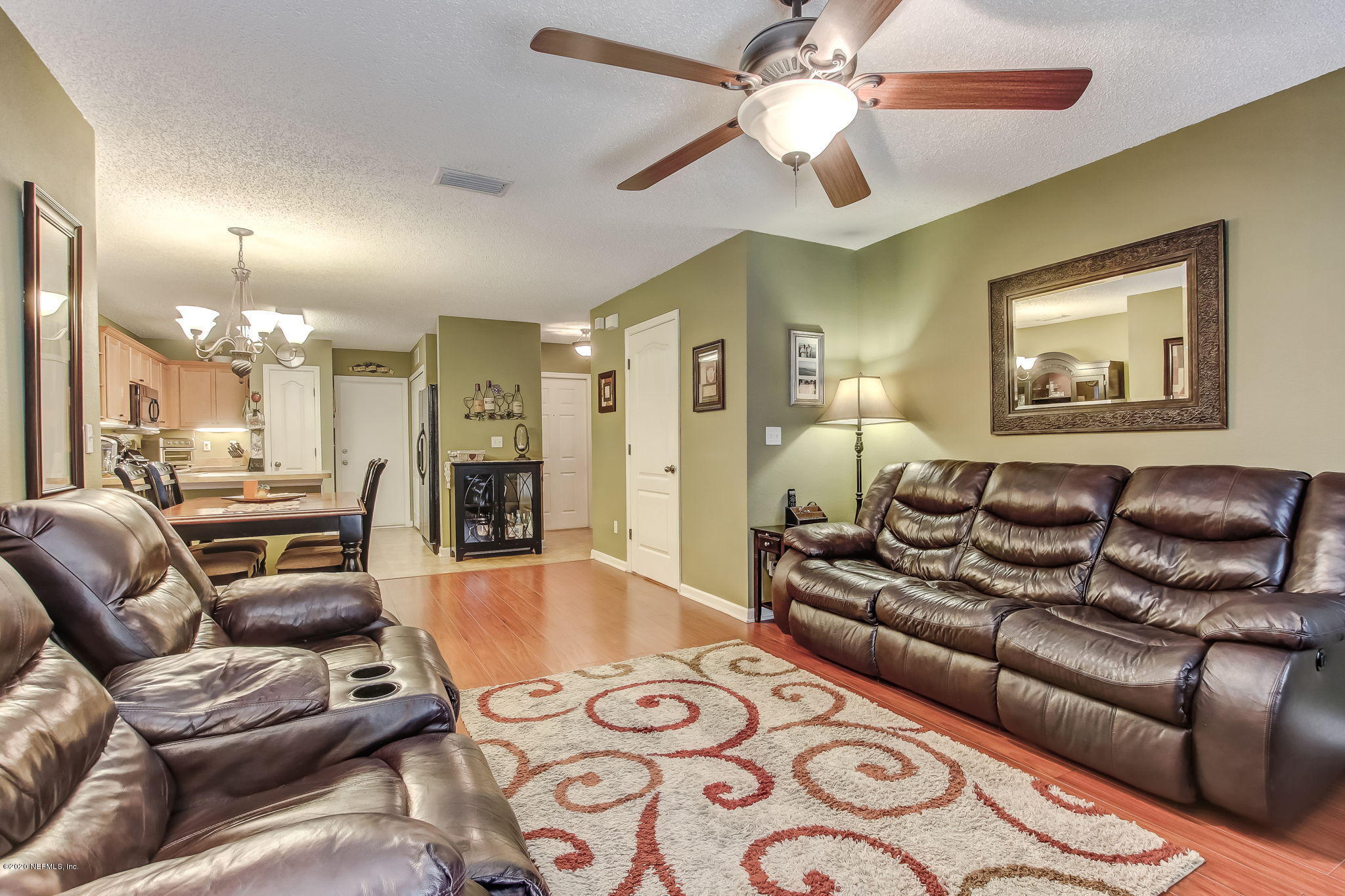 4816 Playschool Drive Jacksonville, FL 32210 - Photo 7 of 49 a living room with furniture and a wooden floor