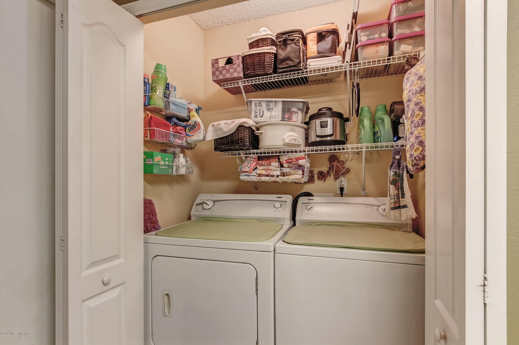 4816 Playschool Drive Jacksonville, FL 32210 - Photo 10 of 49 a utility room with dryer washer and other items