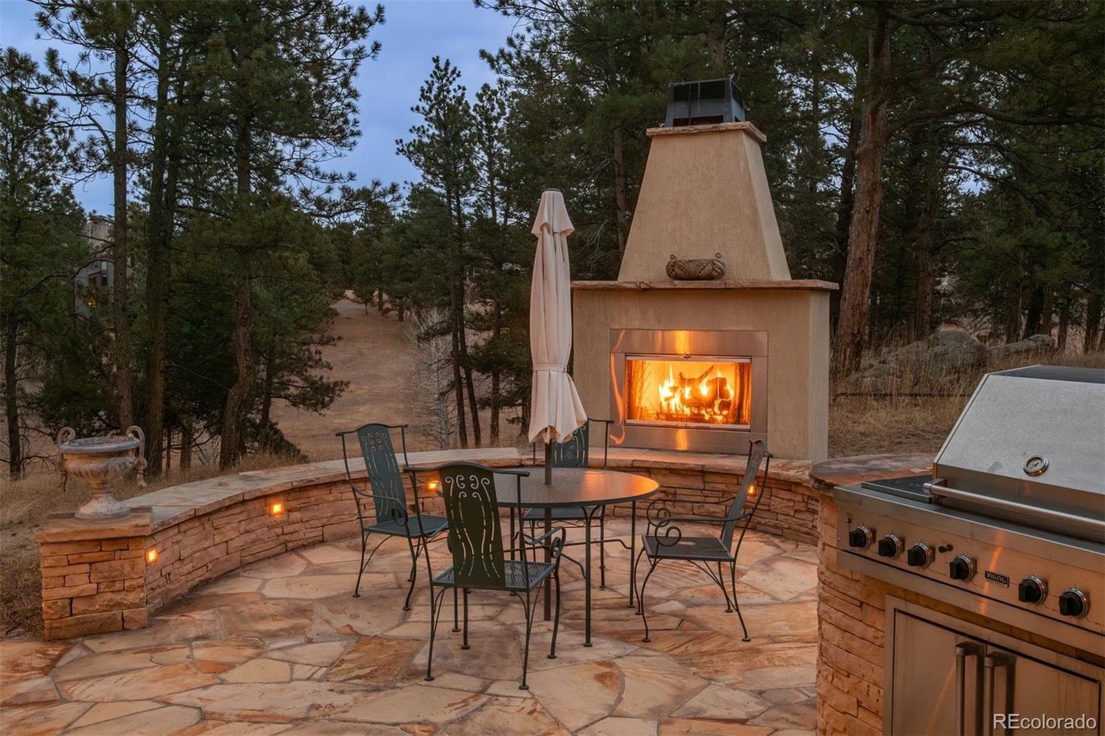 1551 Genesee Ridge Road Golden, CO 80401 - Photo 11 of 50 a view of a tables and chairs in the patio