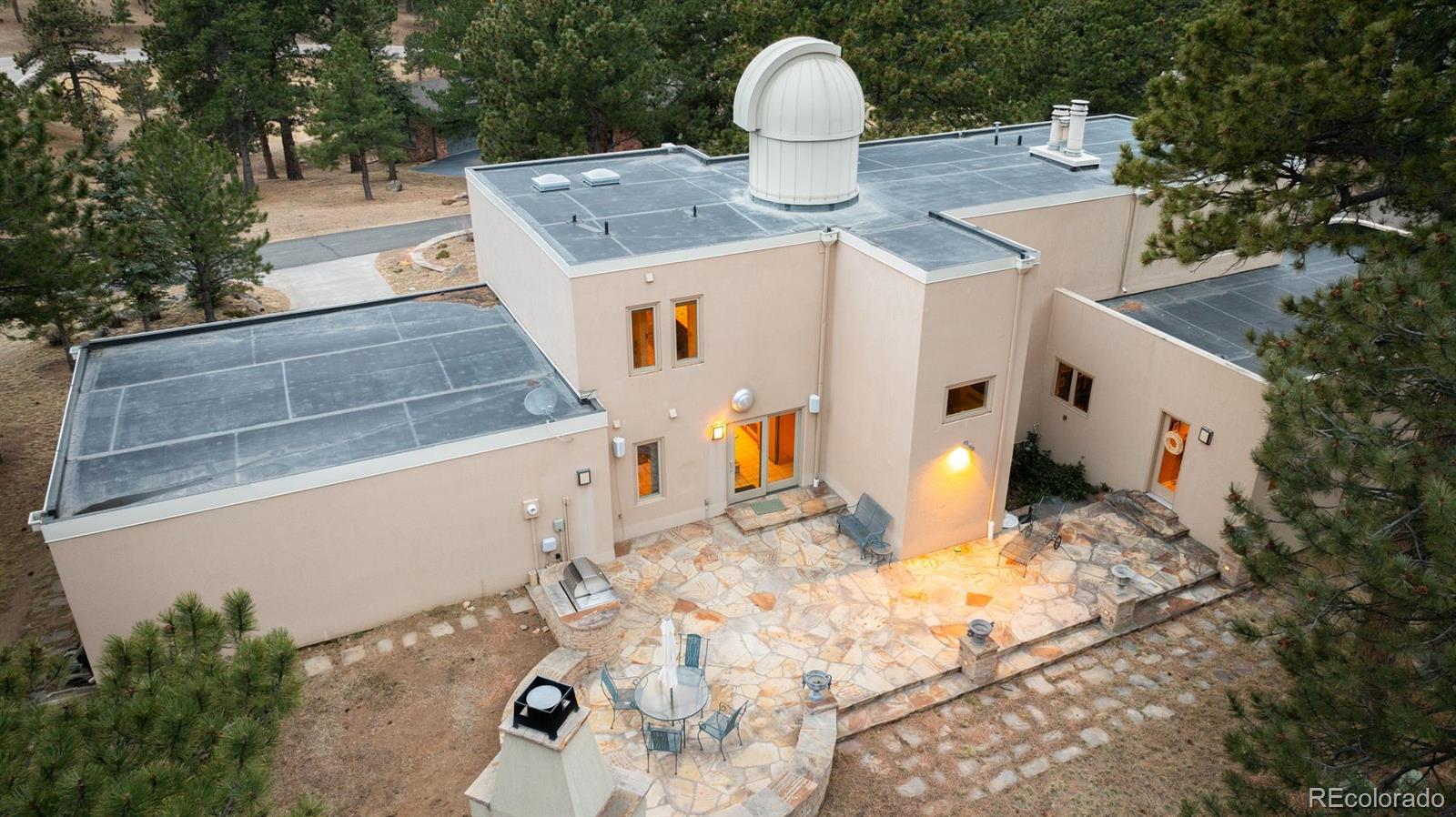 1551 Genesee Ridge Road Golden, CO 80401 - Photo 12 of 50 a view of a white house with a yard