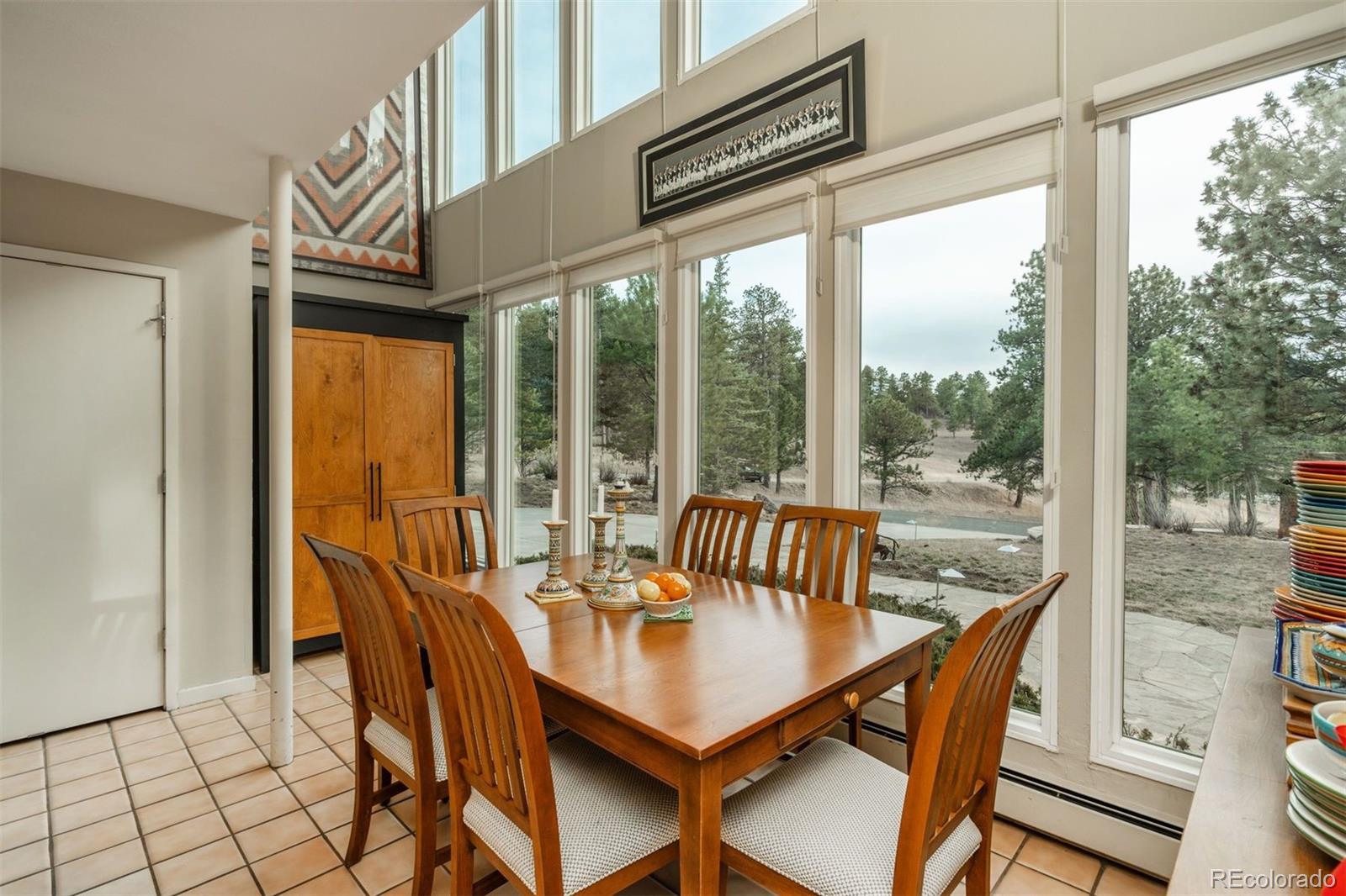 1551 Genesee Ridge Road Golden, CO 80401 - Photo 14 of 50 a view of a city from a dining room with furniture window and outside view