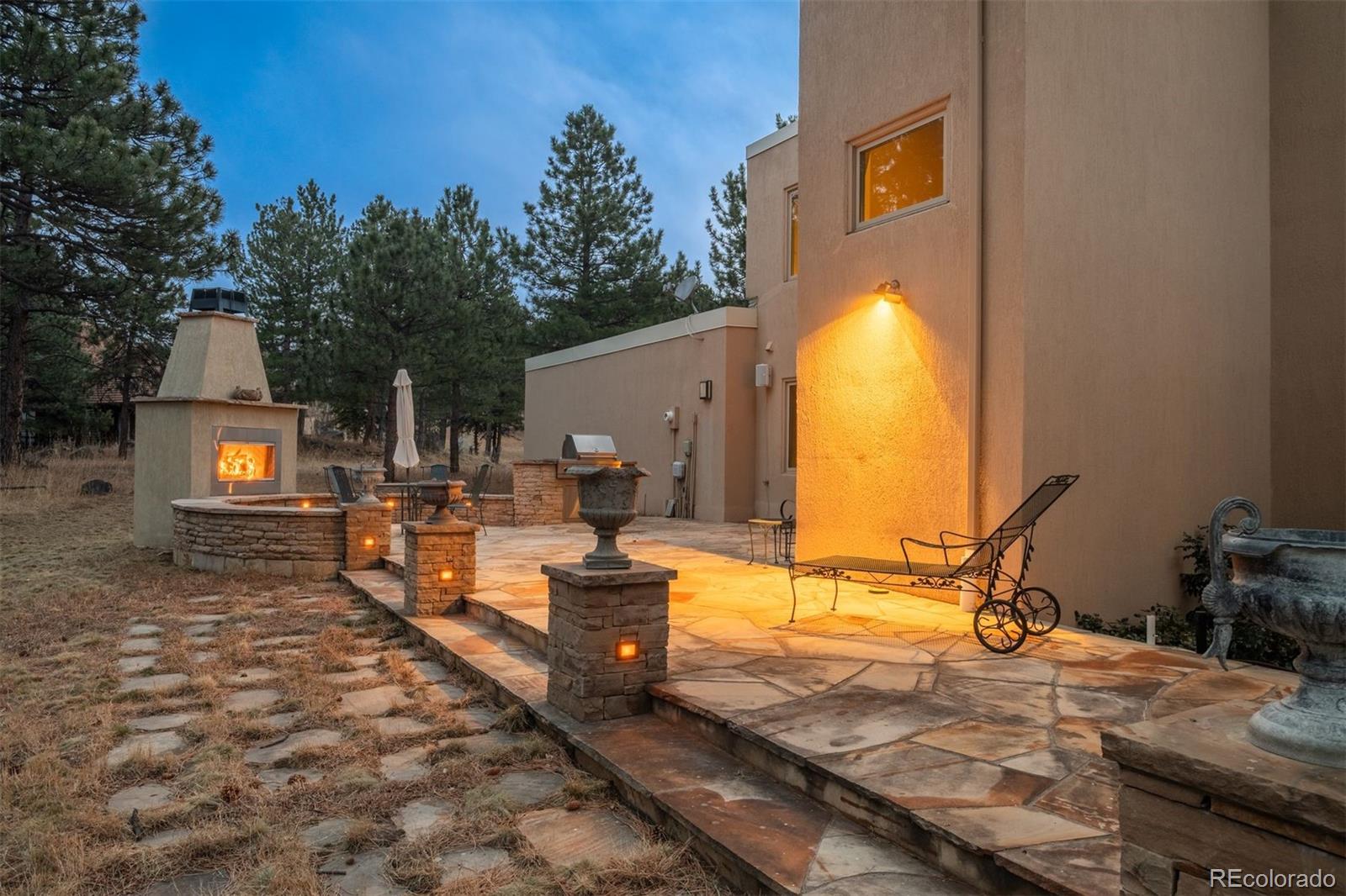 1551 Genesee Ridge Road Golden, CO 80401 - Photo 20 of 50 a view of a backyard with a patio