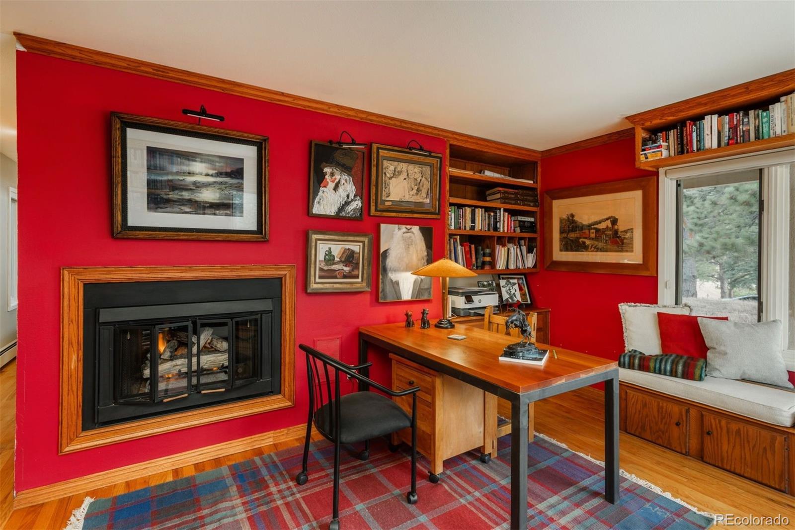 1551 Genesee Ridge Road Golden, CO 80401 - Photo 21 of 50 a living room with furniture and a fireplace