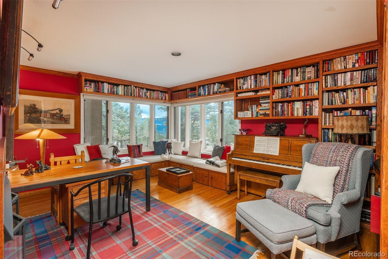 1551 Genesee Ridge Road Golden, CO 80401 - Photo 23 of 50 a living room with furniture and a floor to ceiling window