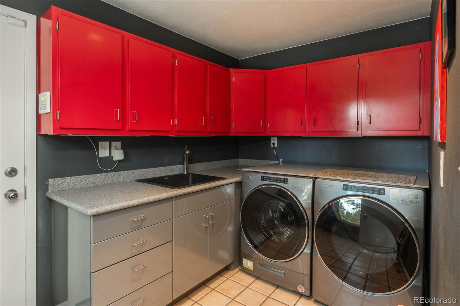 1551 Genesee Ridge Road Golden, CO 80401 - Photo 26 of 50 a utility room with dryer and washer