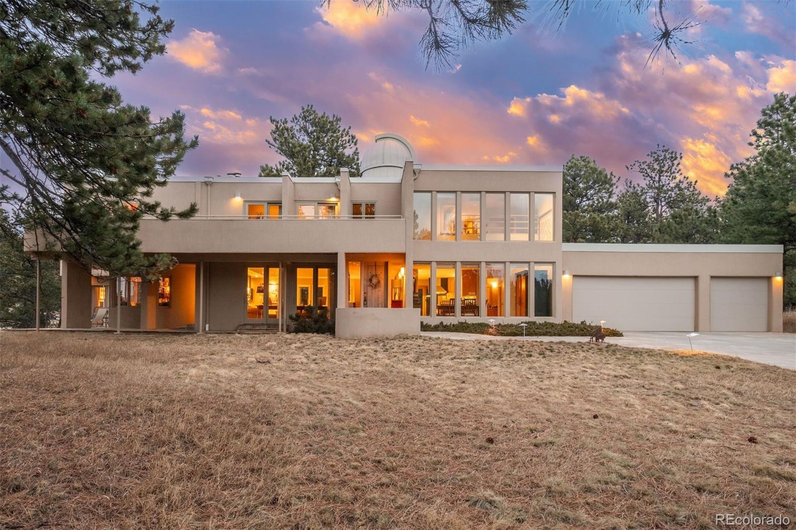 1551 Genesee Ridge Road Golden, CO 80401 - Photo 3 of 50 front view of a house with a yard
