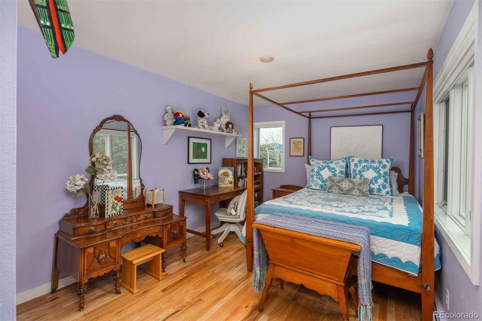 1551 Genesee Ridge Road Golden, CO 80401 - Photo 32 of 50 a dining room with furniture and wooden floor