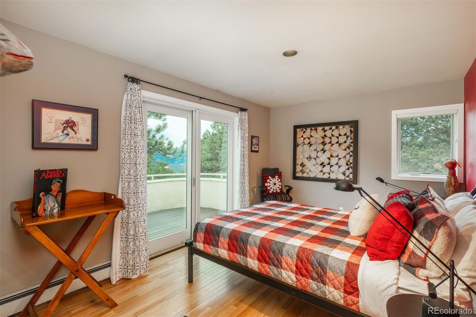 1551 Genesee Ridge Road Golden, CO 80401 - Photo 33 of 50 a bedroom with a bed and a window