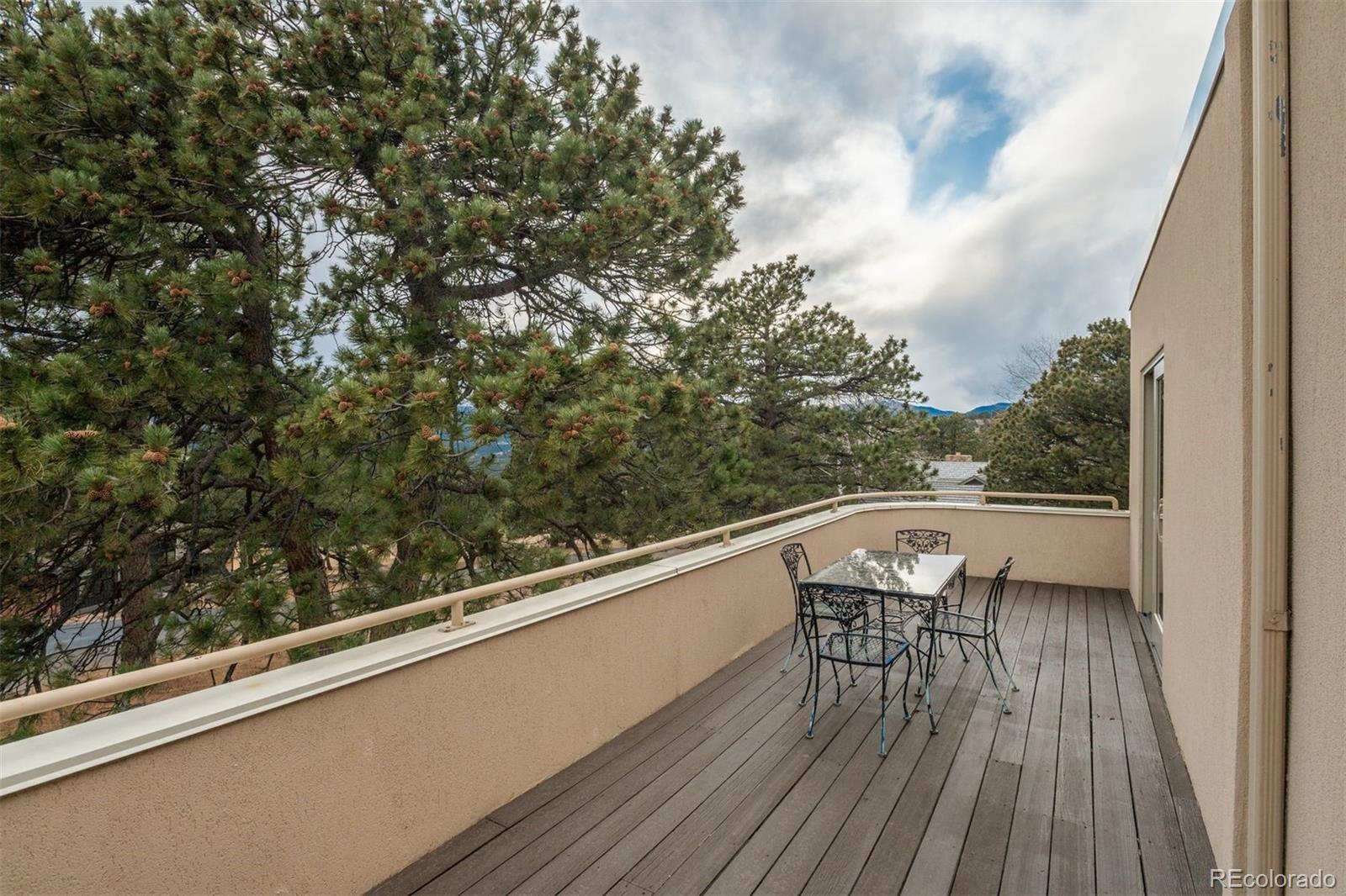 1551 Genesee Ridge Road Golden, CO 80401 - Photo 33 of 50 a view of balcony with furniture and wooden floor