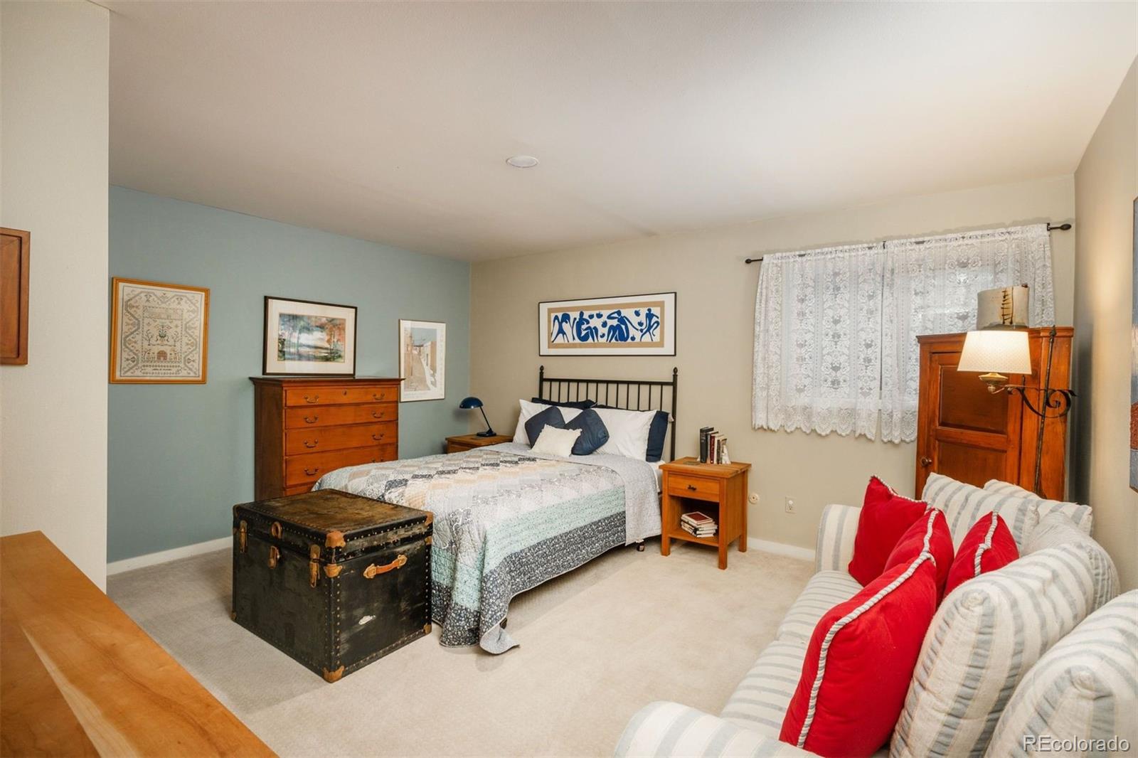 1551 Genesee Ridge Road Golden, CO 80401 - Photo 39 of 50 a bedroom with a bed and a couch