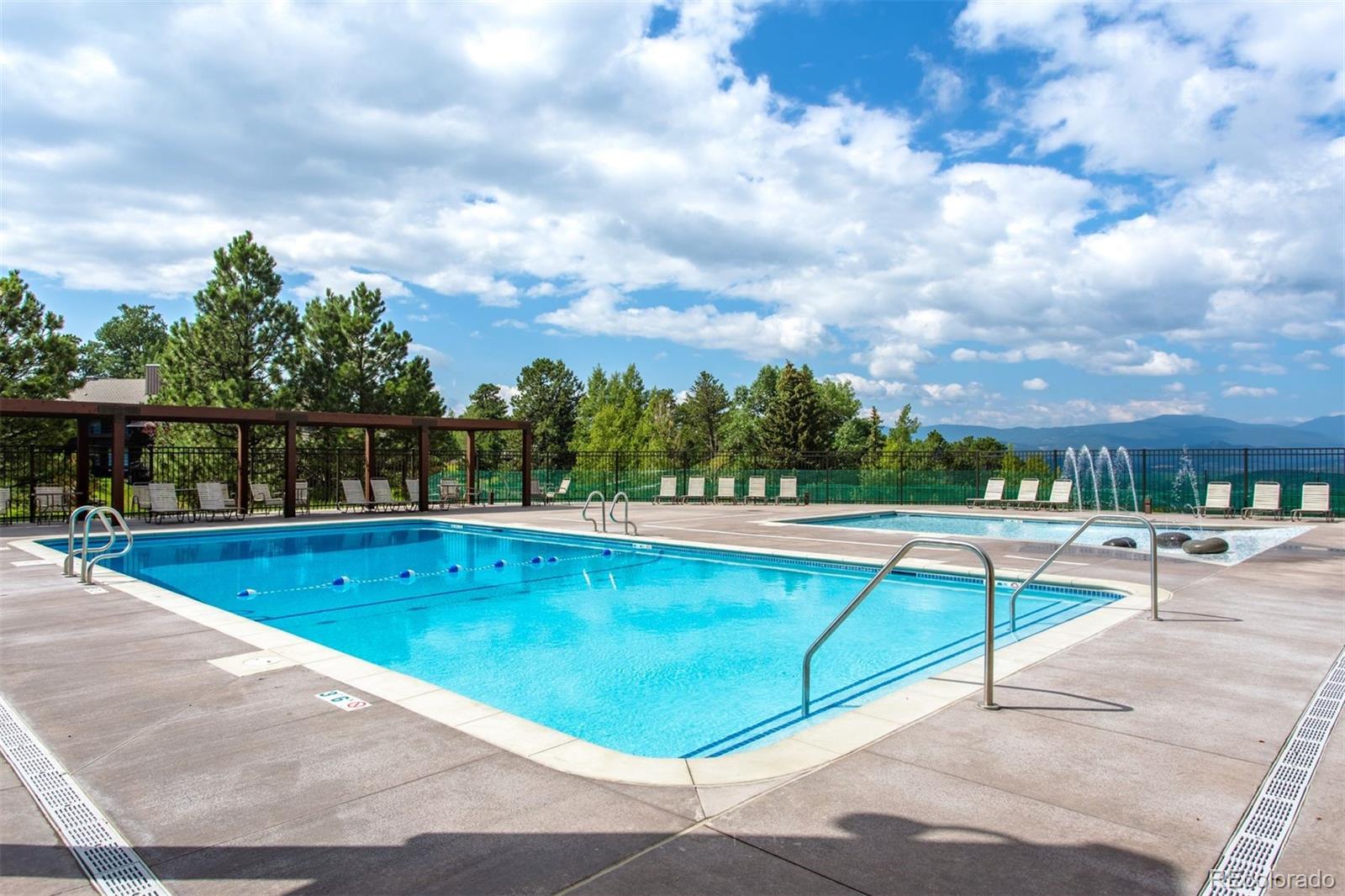 1551 Genesee Ridge Road Golden, CO 80401 - Photo 44 of 50 a view of a swimming pool with a yard