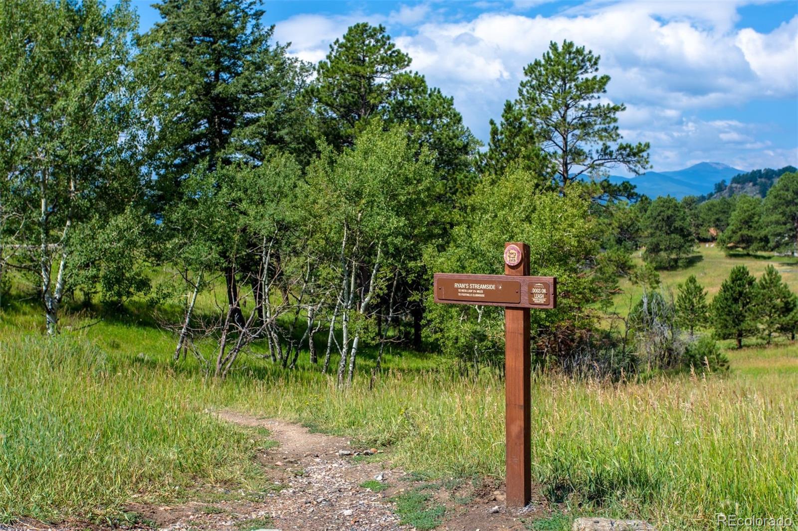 1551 Genesee Ridge Road Golden, CO 80401 - Photo 49 of 50 a lake view with a garden