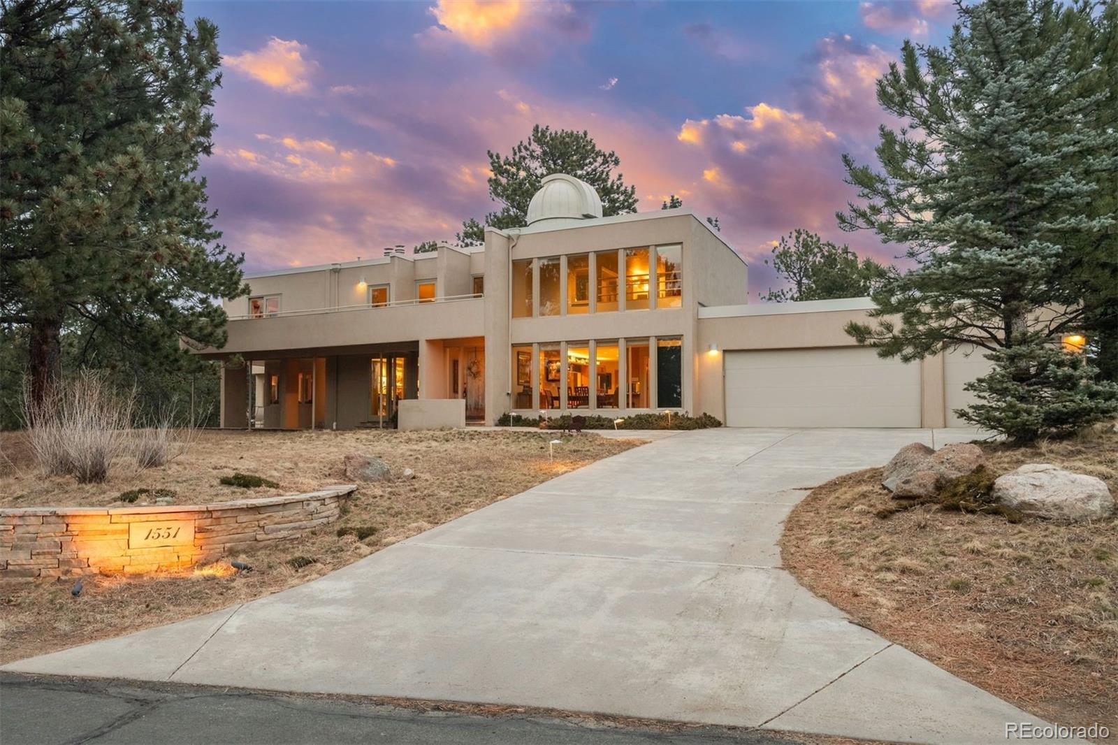 1551 Genesee Ridge Road Golden, CO 80401 - Photo 50 of 50 a front view of a house with a yard