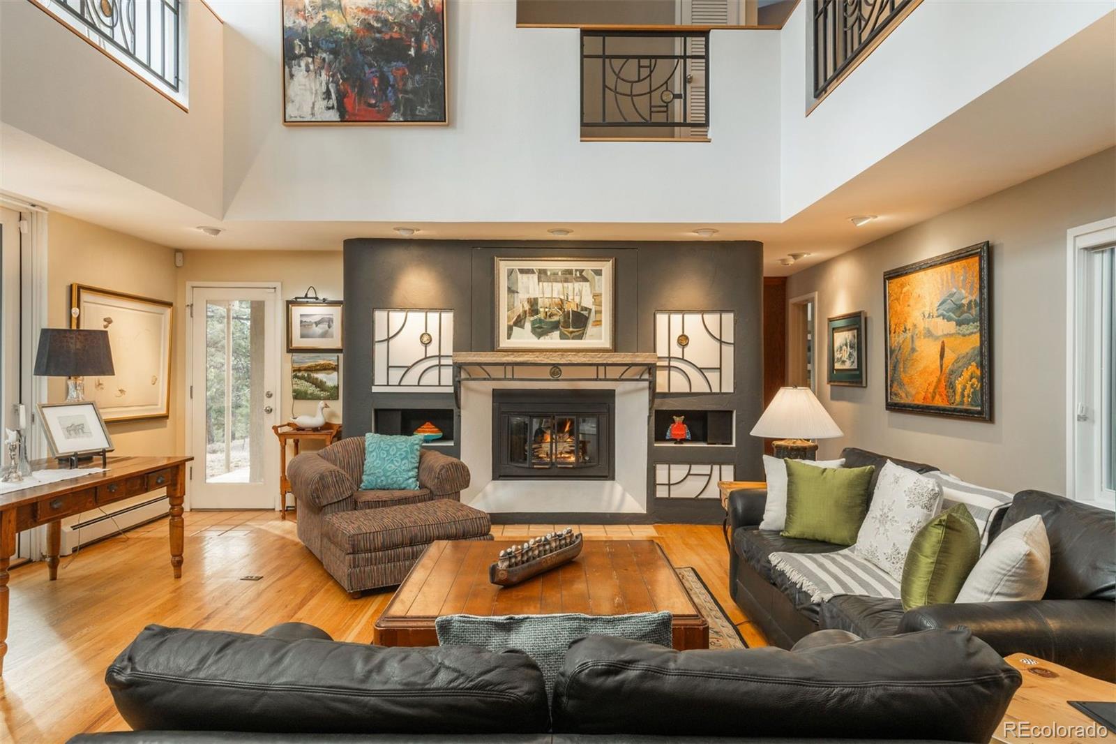 1551 Genesee Ridge Road Golden, CO 80401 - Photo 5 of 50 a living room with furniture and a fireplace