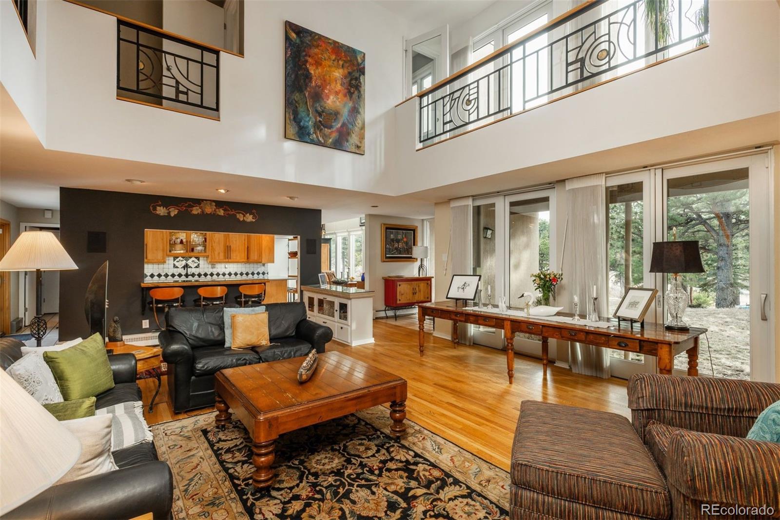 1551 Genesee Ridge Road Golden, CO 80401 - Photo 6 of 50 a living room with furniture and a flat screen tv