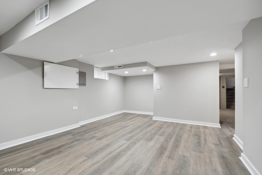 2490 Green Bay Road, Unit 1 Highland Park, IL 60035 - Photo 12 of 18 wooden floor in an empty room with a window