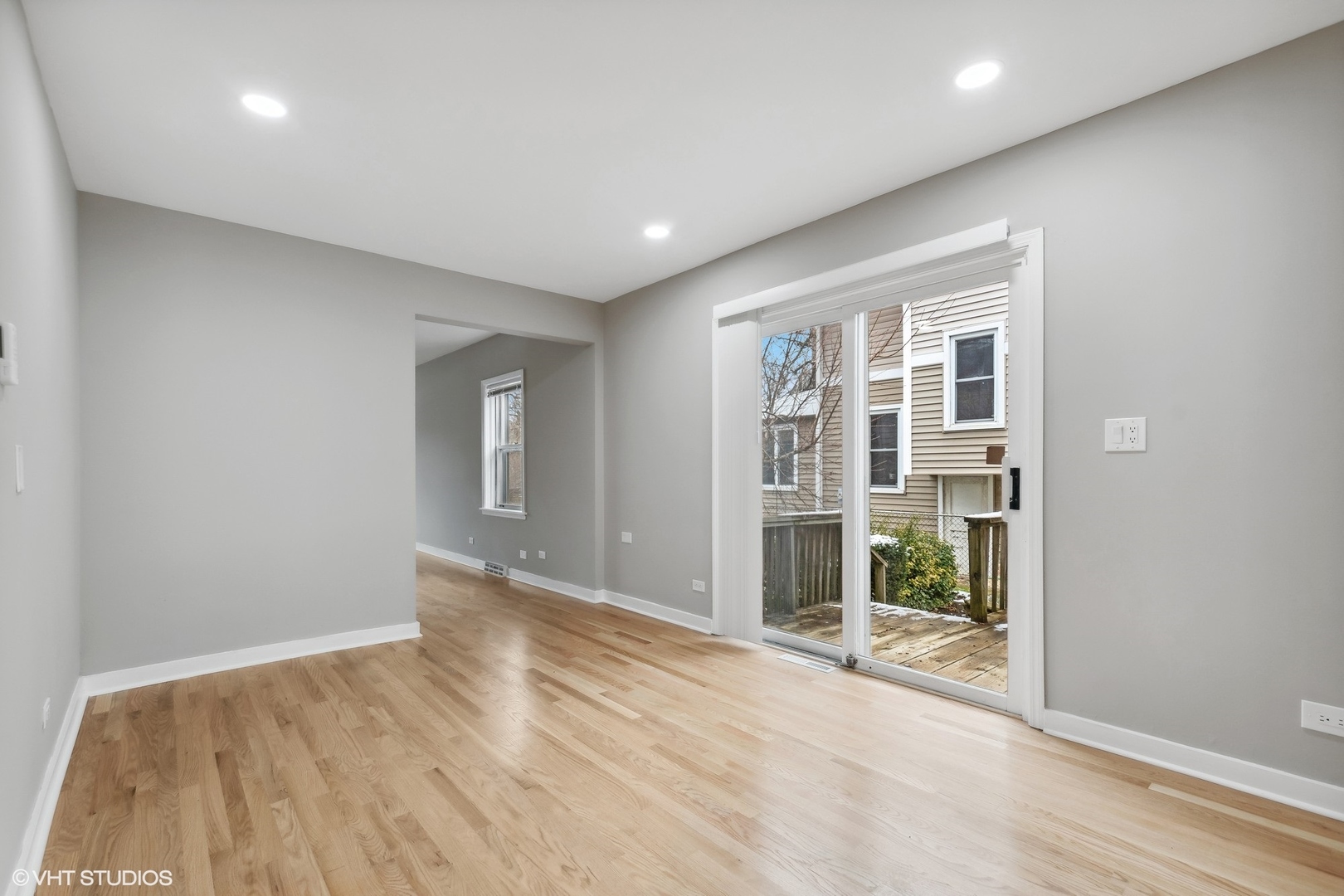 2490 Green Bay Road, Unit 1 Highland Park, IL 60035 - Photo 7 of 18 a view of an empty room with wooden floor and a window
