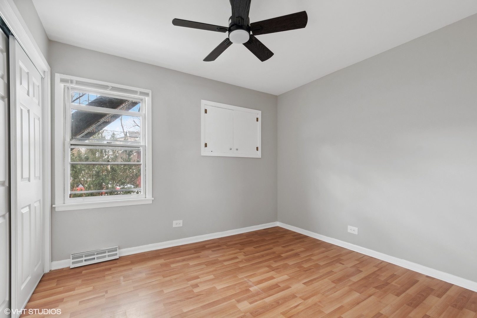 2490 Green Bay Road, Unit 1 Highland Park, IL 60035 - Photo 10 of 18 a view of empty room with wooden floor and ceiling fan