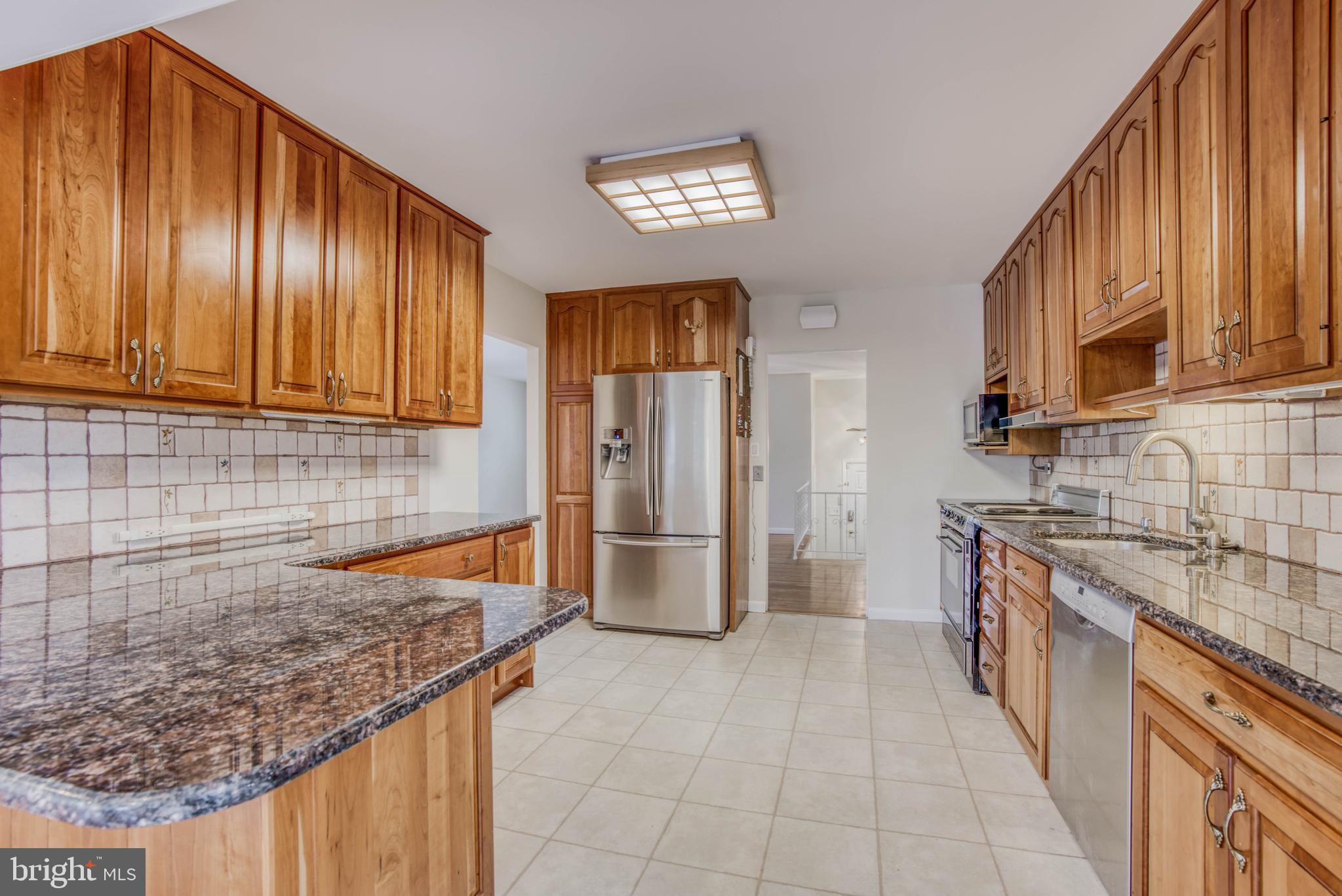 300 West Timonium Road Lutherville-Timonium, MD 21093 - Photo 22 of 50 Granite countertops, Cherry cabinets
