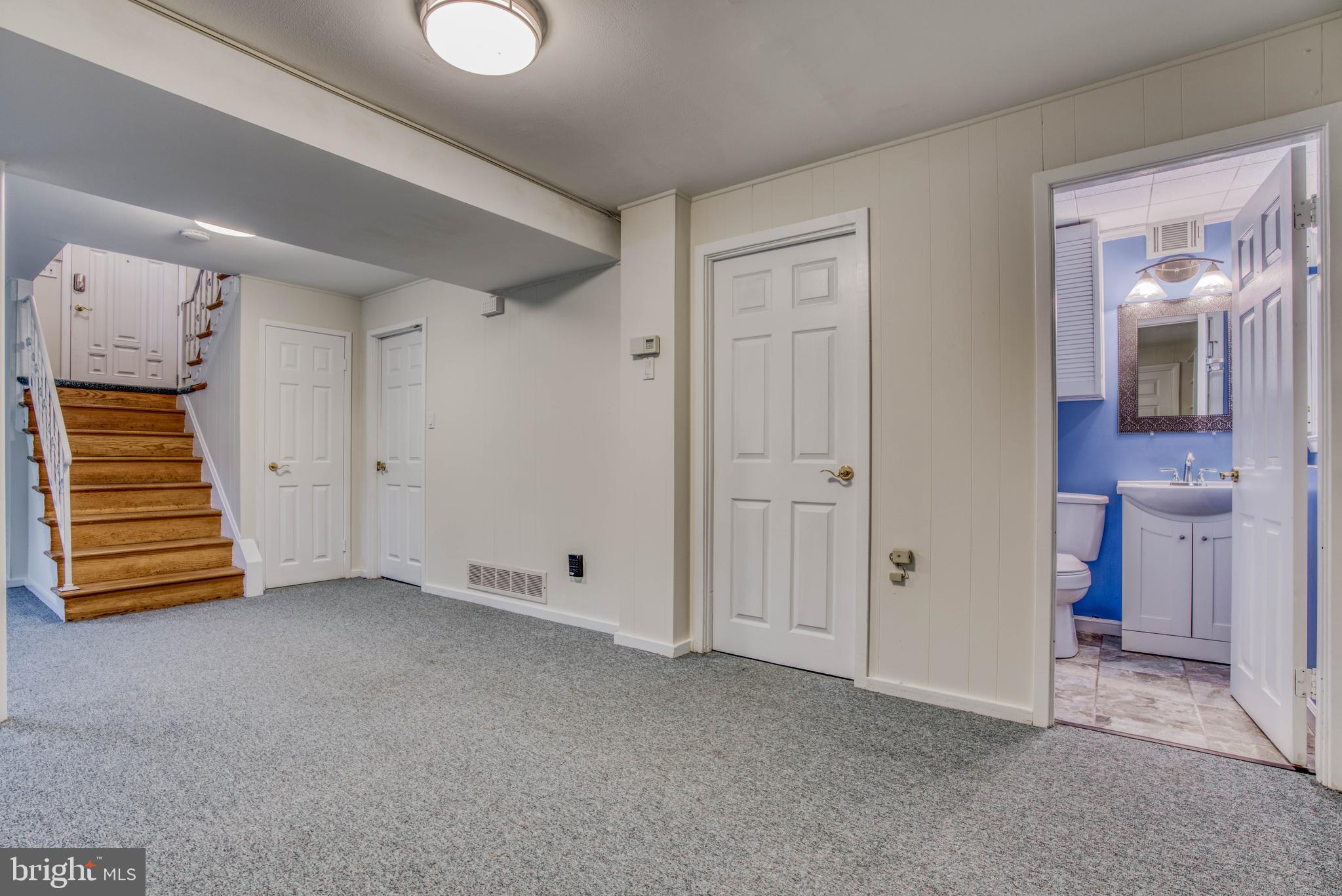 300 West Timonium Road Lutherville-Timonium, MD 21093 - Photo 43 of 50 Family room looking into half bath