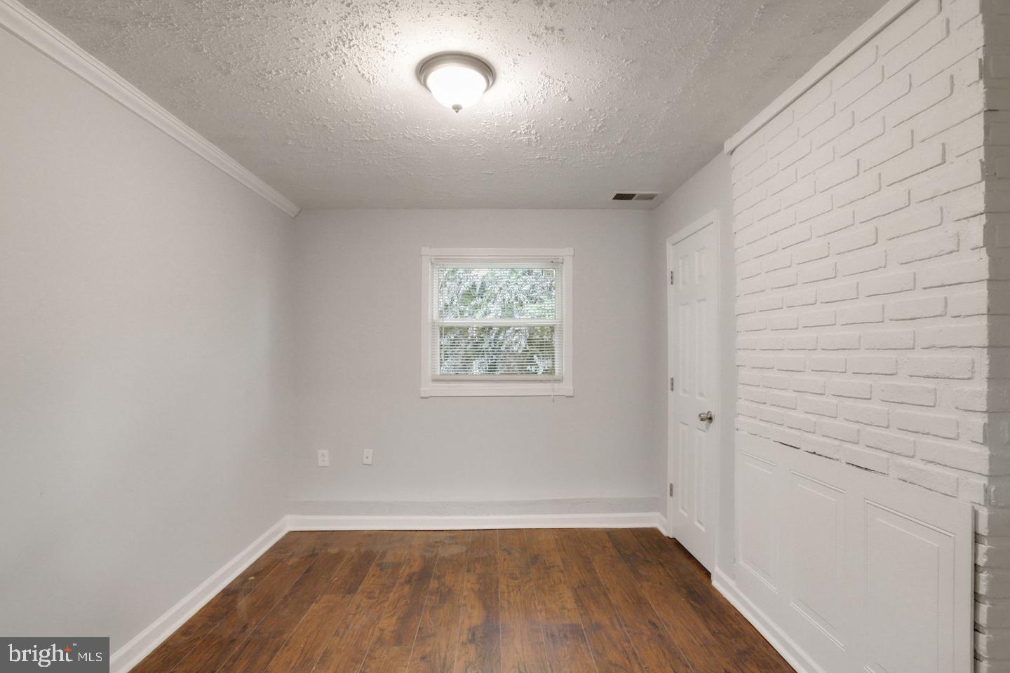 5504 Keppler Road Temple Hills, MD 20748 - Photo 15 of 19 wooden floor in an empty room with a window